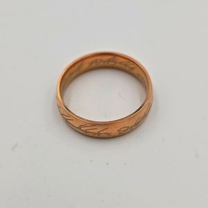 Golden tone ring with etching